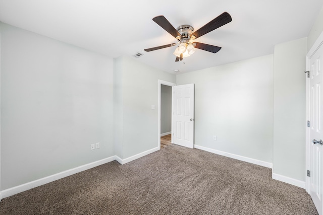 carpeted empty room with ceiling fan