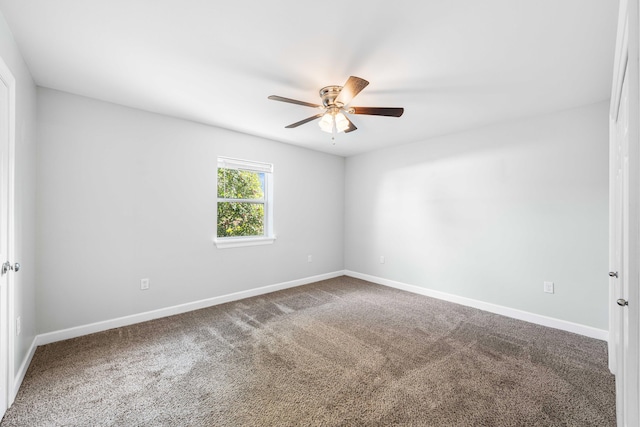 carpeted empty room with ceiling fan