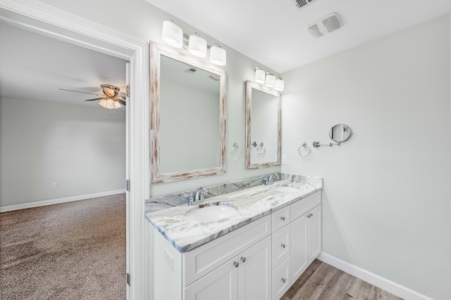 bathroom with ceiling fan and vanity