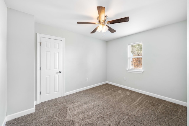 spare room with carpet floors and ceiling fan