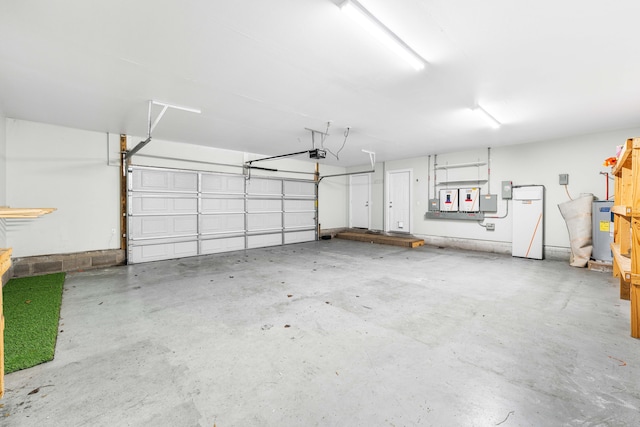 garage featuring a garage door opener and electric water heater