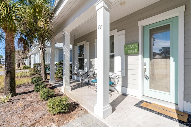 doorway to property featuring covered porch