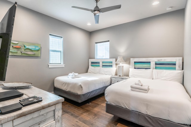 bedroom featuring ceiling fan and dark hardwood / wood-style floors