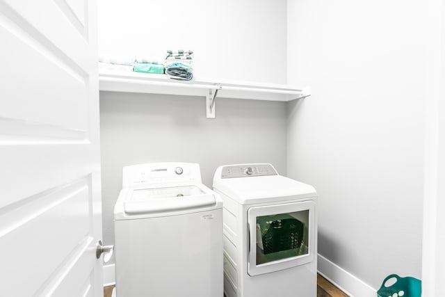 laundry room with washing machine and dryer