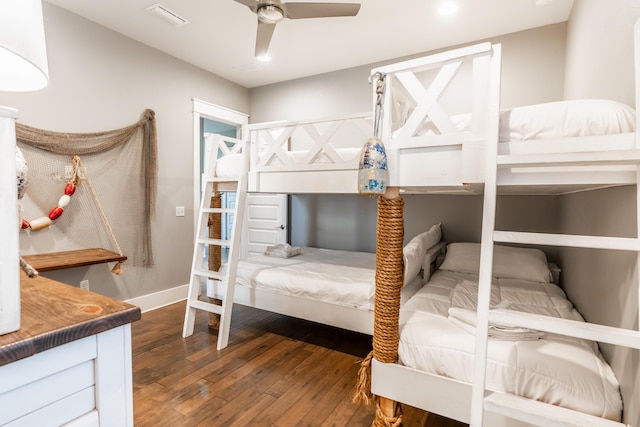 bedroom featuring ceiling fan and dark hardwood / wood-style flooring