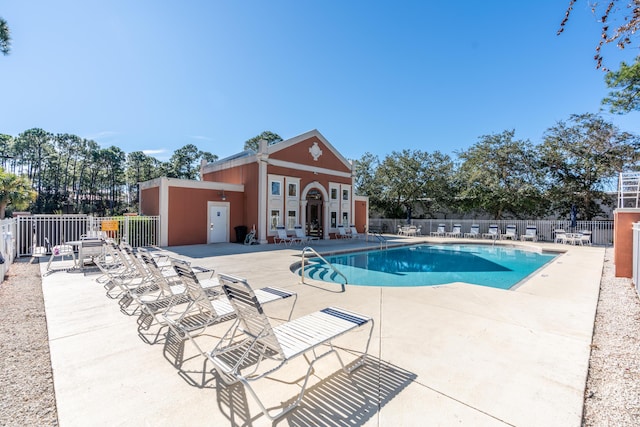 view of swimming pool featuring a patio