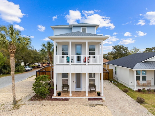 view of front of house with a balcony and a porch