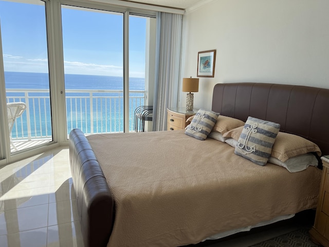 bedroom with crown molding, tile patterned floors, and a water view