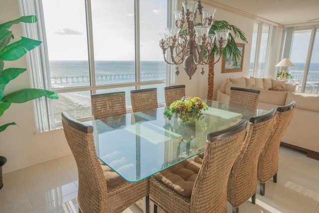 tiled dining space with a water view, an inviting chandelier, and a wall of windows