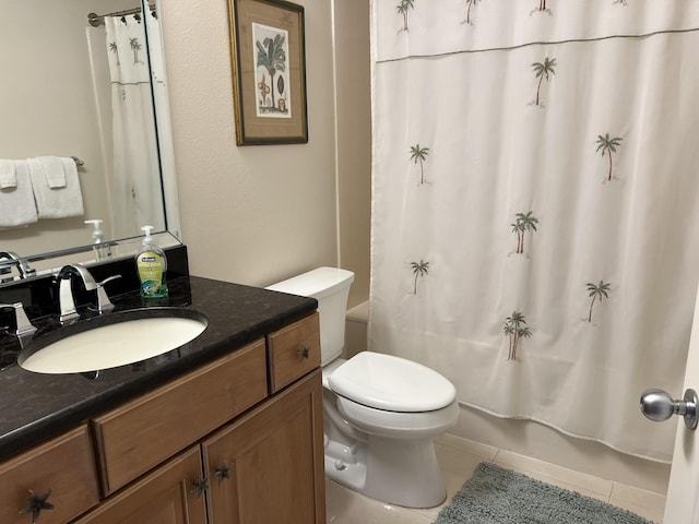 full bathroom with shower / tub combo with curtain, vanity, toilet, and tile patterned flooring