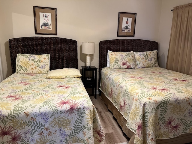 bedroom with wood-type flooring