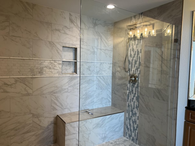 bathroom featuring vanity and a tile shower