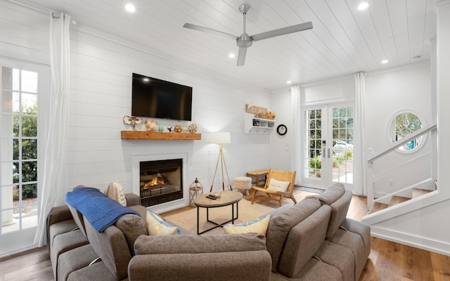 living room with hardwood / wood-style floors, wooden ceiling, french doors, and ceiling fan