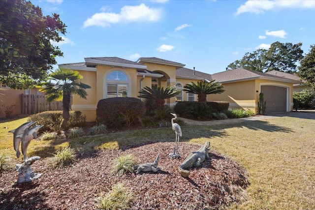 view of front facade with a garage and a front lawn