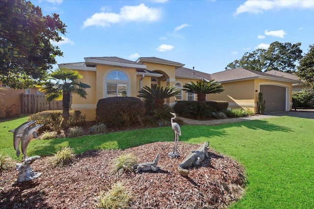 view of front of house with a garage and a front lawn