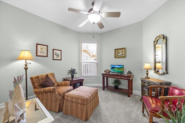 sitting room with light colored carpet and ceiling fan