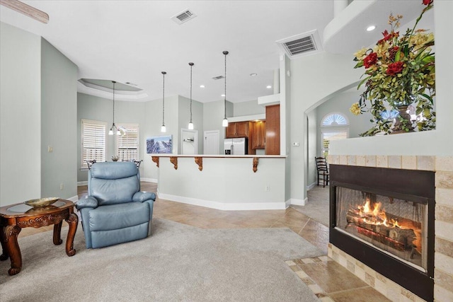 interior space featuring a tiled fireplace