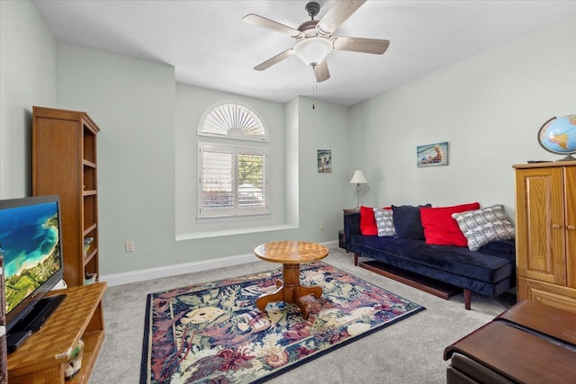 living room featuring ceiling fan and light colored carpet