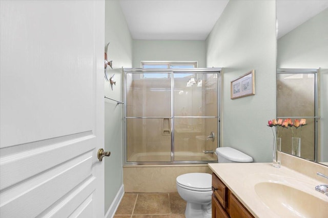 full bathroom with vanity, toilet, enclosed tub / shower combo, and tile patterned flooring