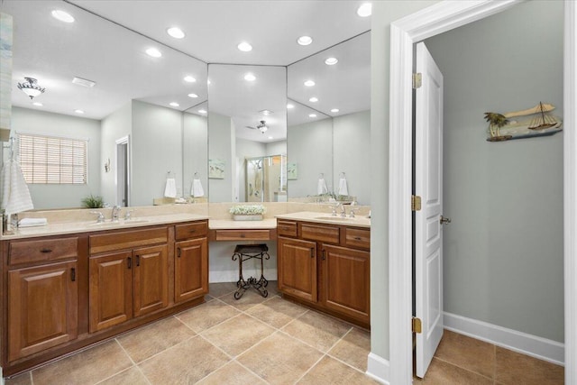 bathroom with vanity and a shower with shower door