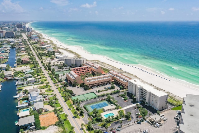 bird's eye view with a water view and a beach view