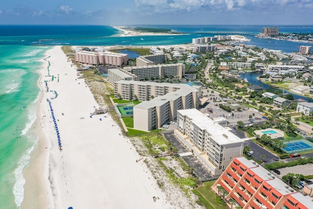 birds eye view of property with a water view and a view of the beach