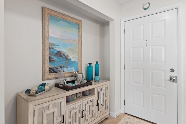 entrance foyer featuring light tile patterned floors