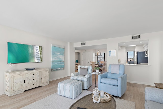 living room with light hardwood / wood-style floors