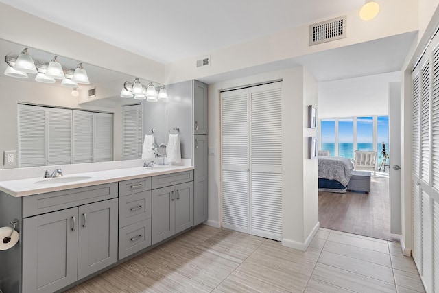 bathroom with vanity and tile patterned floors