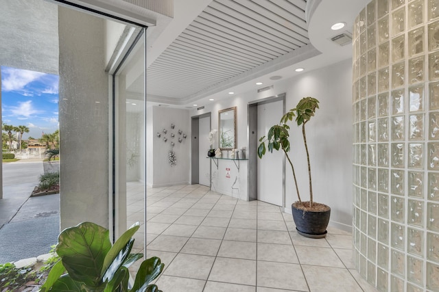 corridor with light tile patterned flooring