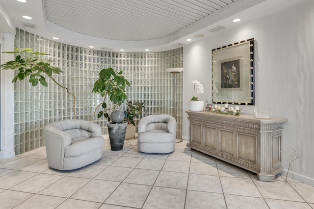 bathroom with tile patterned flooring, vanity, and a tray ceiling