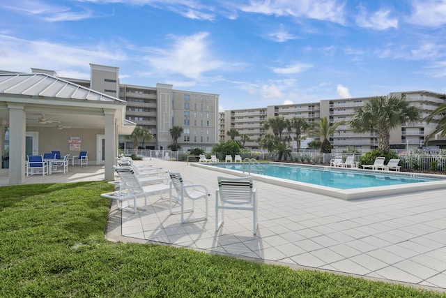 view of pool featuring a patio area and ceiling fan