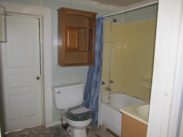 full bathroom featuring toilet, vanity, ornamental molding, and shower / tub combo with curtain