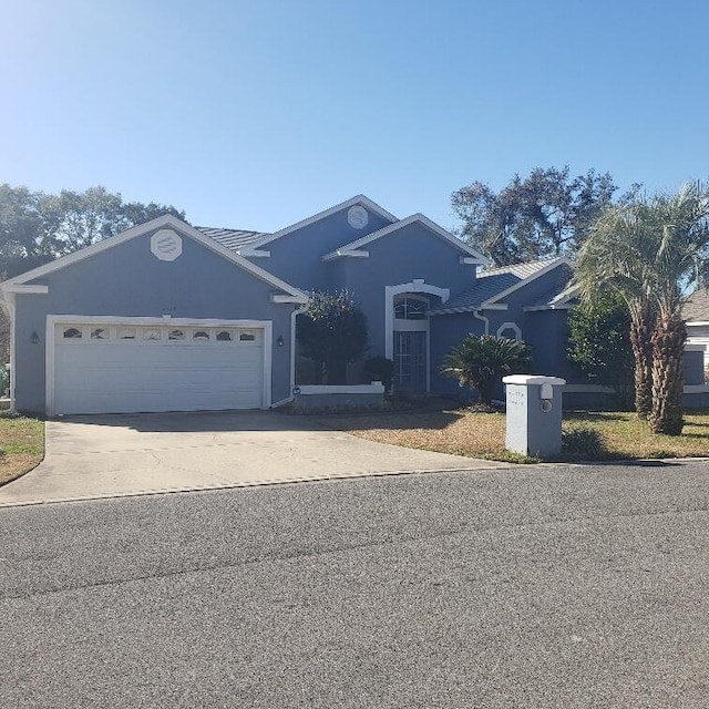 single story home featuring a garage