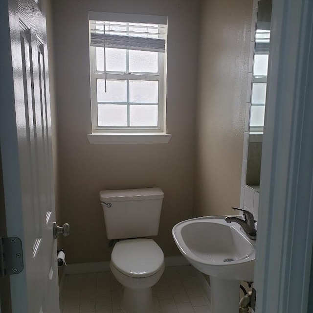 bathroom with toilet and sink