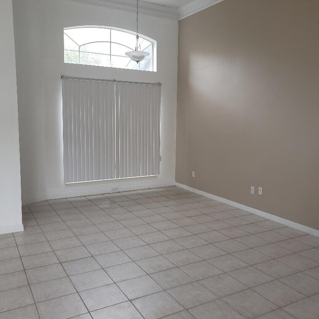 spare room with crown molding