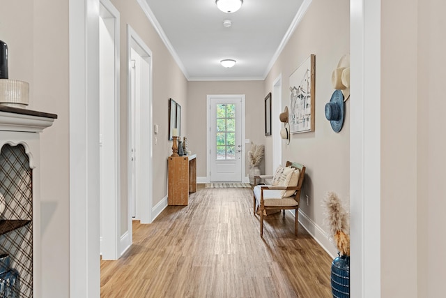 corridor with crown molding and light wood-type flooring