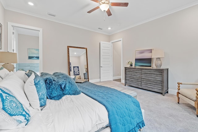 bedroom with light carpet, ceiling fan, and crown molding