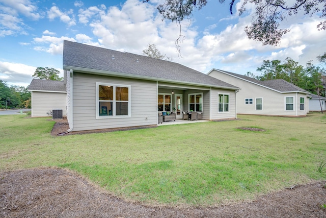 back of house with a yard, a patio, and central air condition unit