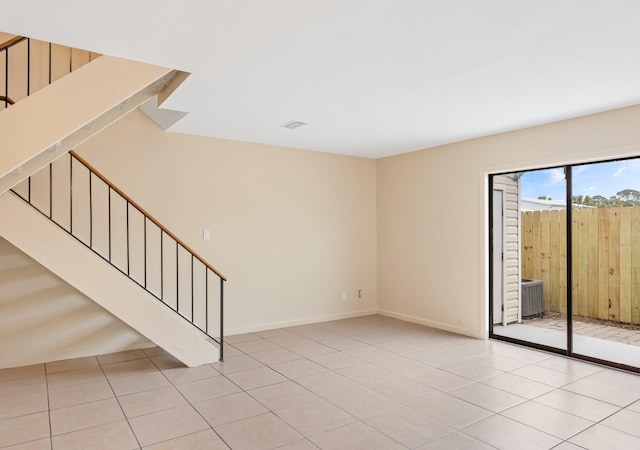 unfurnished room with light tile patterned floors