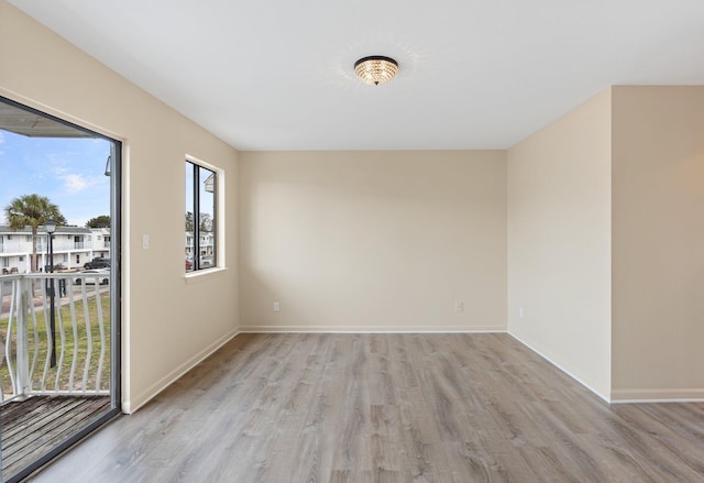 unfurnished room with light hardwood / wood-style floors