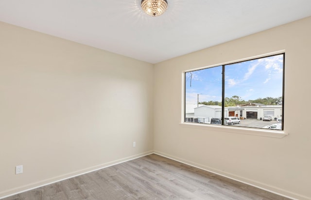 empty room with light hardwood / wood-style floors