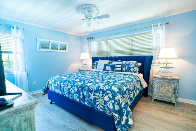 bedroom with crown molding and ceiling fan