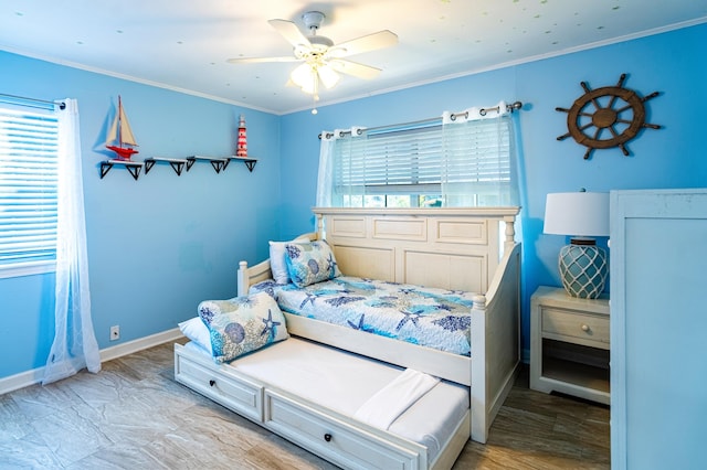 bedroom with ceiling fan and ornamental molding