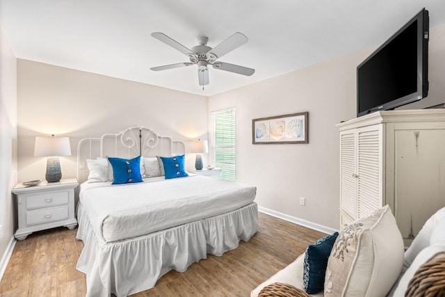 bedroom with ceiling fan and light hardwood / wood-style flooring