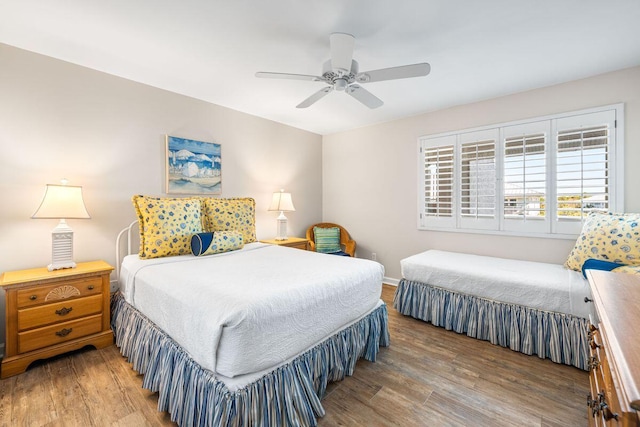 bedroom with wood-type flooring and ceiling fan