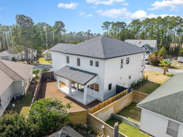 back of property featuring central AC unit and a patio area