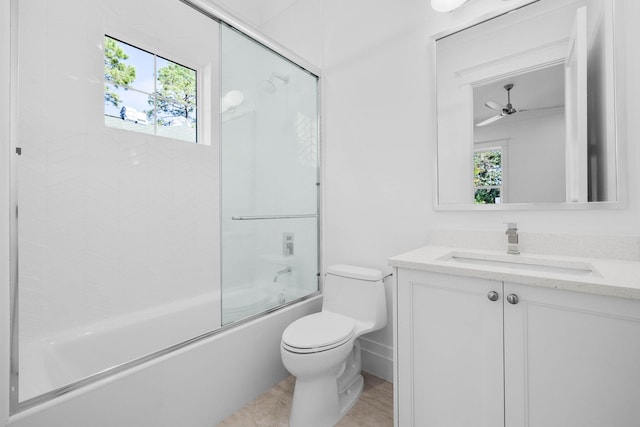 full bathroom with enclosed tub / shower combo, plenty of natural light, toilet, and vanity