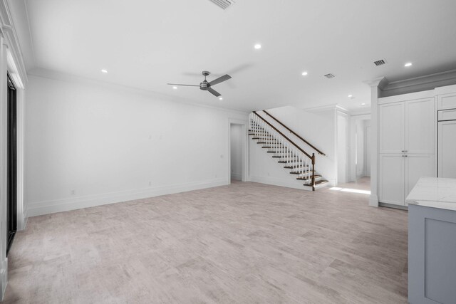 unfurnished living room with ornamental molding, light hardwood / wood-style floors, and ceiling fan