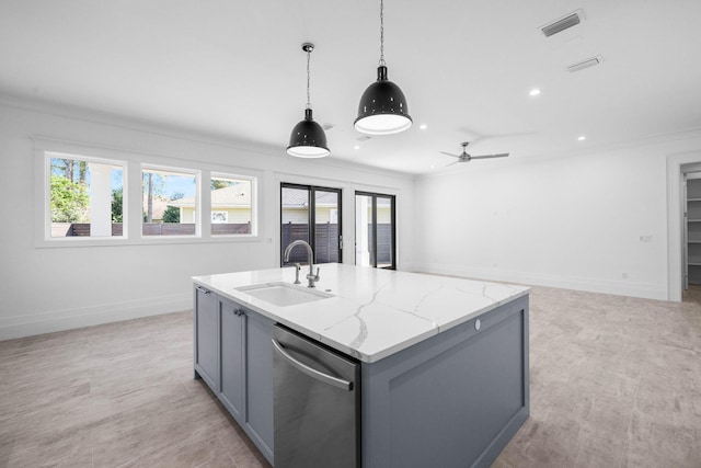 kitchen featuring sink, light stone counters, decorative light fixtures, stainless steel dishwasher, and a kitchen island with sink